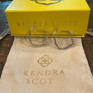 Kendra Scott silver hoop earrings.